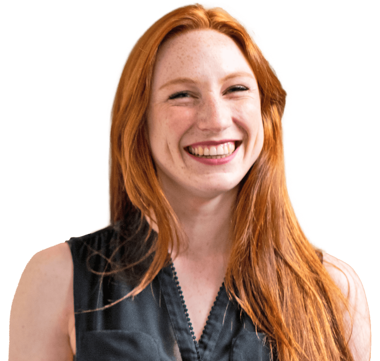 Happy woman with red hair smiling and looking at the camera